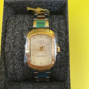 Brand NEW NIB! Never worn. Still has wrapping. Silver and gold band